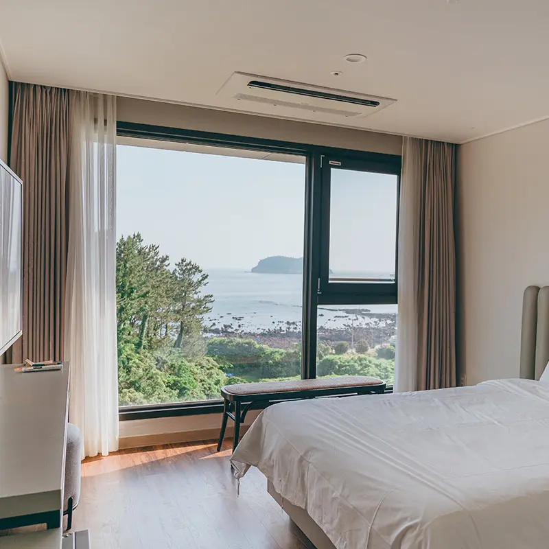 A room at Hotel Seogwipean with a view of Munseom Island